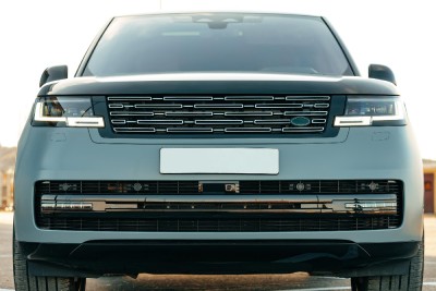 Closeup of the radiator grill and front bumper of a luxury car